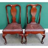 A pair of George II mahogany side chairs with vase back and straight front seat on pad feet,