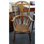 A pair of Victorian style ash and elm Windsor chairs, with solid seats and turned supports,