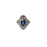 A heat treated sapphire and diamond set oval panel shaped cluster ring,