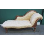 A Victorian carved mahogany scroll end chaise longue, on cabriole supports, 195cm wide x 91cm high.