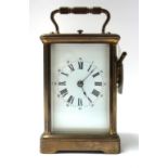 A French brass cased carriage clock, late 19th century, with visible escapement, push repeat,