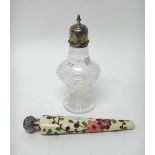 A silver mounted faceted glass sugar caster, the top with floral engraved decoration,