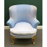 A George I style tub back easy chair, with bow seat, on painted cabriole supports,