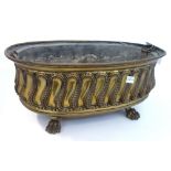 A Victorian brass jardiniere of oval fluted form,