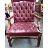 A George III style brass studded rouge leather upholstered open armchair,
