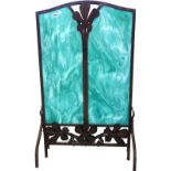 A French Art Nouveau wrought iron fire screen with inset faux hardstone panels,