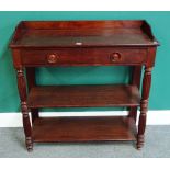 A 19th century French mahogany three tier buffet, with single drawer on waisted reeded supports,