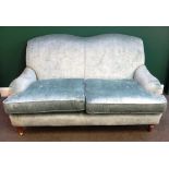 A 20th century double hump back sofa, on turned supports, 165cm wide x 93cm high.