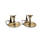 A pair of George III silver chamber candlesticks, each of circular form, within a reeded rim,