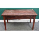 A 19th century French oak dough table, the plank top revealing a dough bin undertier,