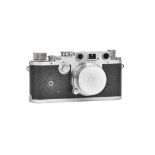 A Leica IIIc camera, circa 1935, serial number 396840, with a summar lens and fitted leather case.