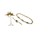 A gold and seed pearl brooch, designed as two swallows in flight, detailed 15 CT,