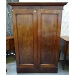A Victorian mahogany two door wardrobe on plinth base, of small proportions,