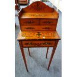 A late Victorian floral painted rosewood banded satinwood cheveret, with four drawers,