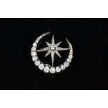 A Victorian diamond brooch, designed as a crescent enclosing an eight pointed star,