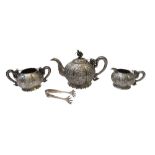 A Chinese three piece tea set, comprising; a teapot, a twin handled sugar bowl and a milk jug,