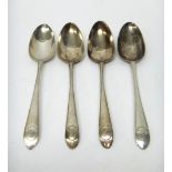 A pair of George III Irish silver bottom marked feather edged Old English pattern tablespoons,