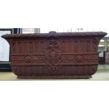 A Victorian rectangular cast iron planter, relief cast with floral tracery and cherub heads,