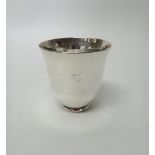 An Italian beaker by Pampaloni, of tapered form, having martele decoration, on a circular foot,