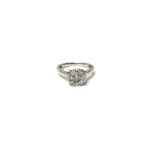 An 18ct white gold and diamond nine stone cluster ring,