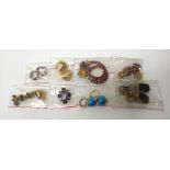 Eight pairs of mostly gem set costume earclips, in a variety of modern designs,