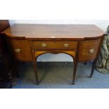 An early 19th century satinwood banded inlaid mahogany bowfront sideboard with central drawer