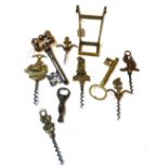 A collection of corkscrews, including two large 'keys', 18cm high,