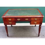 A Victorian mahogany writing desk, with five drawers about the knee, on tapering reeded supports,