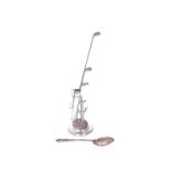 A silver mounted hat pin stand, formed as a golf clubs bag and a tree, Birmingham 1910,