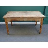 An early Victorian pine plank top kitchen table, with frieze drawer on tapering square supports,