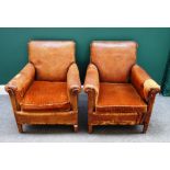 A pair of mid-20th century French brass studded brown leather upholstered easy armchairs,