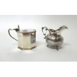 Silver, comprising; an octagonal mustard pot, London 1935, with a blue glass liner and a cream jug,