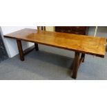 A 19th century French kitchen table, with cleated twin plank fruitwood top on square oak supports,