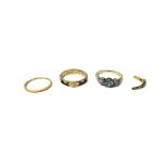 A gold ring, claw set with a circular cut blue zircon, between two circular cut diamonds,