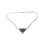 A sapphire and diamond necklace, the front in a curved triangular design,