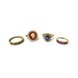 A gold and ruby set seven stone ring, mounted with a row of graduated rubies, a French gold,