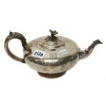 A late William IV silver teapot, of compressed circular form,
