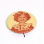 A vintage Shirley Temple badge with a se