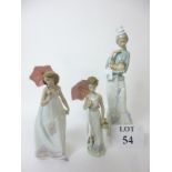 A large Lladro figurine of a lady holding a Pekingese dog; and two smaller figurines,