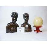 A pair of African carved rosewood figural busts and an ostrich egg on glass stand est: £25-£45 (A2)