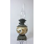 A vintage oil lamp with painted ceramic reservoir est: £25-£45 (A1)