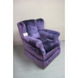 A c1900 re-upholstered winged armchair upholstered in purple velvet material very clean condition