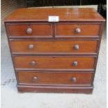 A Victorian mahogany chest of two short over three long drawers with turned handles est: £100-£150