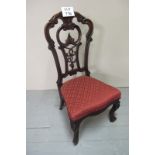 A pair of Victorian mahogany ornate carved chairs upholstered in Burgundy & Gold est: £40-£60