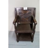 A 20c oak Monk's chair with carved top est: £50-£80