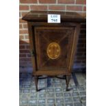 A fine Edwardian mahogany inlaid slim cupboard with five panelled door inlaid with central lyre