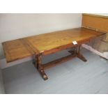 A country design oak draw leaf refectory dining table with two pull out end leaves (102" extended)