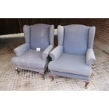 A pair of 20c winged armchairs upholstered in blue (some marks) est: £80-£120