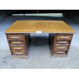 A c1900 oak writing desk with seven drawers est: £30-£50