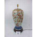 A large decorative Chinese blue and white lamp base decorated with figures amongst clouds and